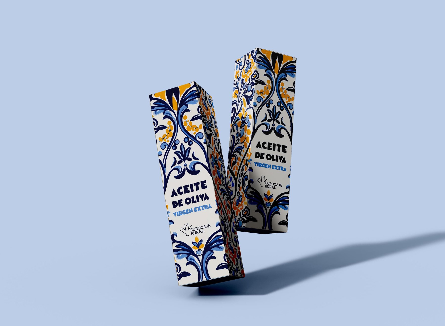 Pareja de cajas de Oleotoledo en perspectiva, una más cerca y otra al fondo, mostrando dos composiciones distintas del patrón cerámico